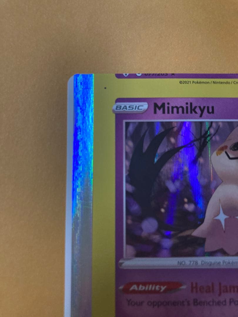 Mimikyu Japanese trading card with large vertical and horizontal cutting error from overseas edition