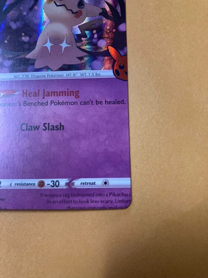 Mimikyu Japanese trading card with large vertical and horizontal cutting error from overseas edition