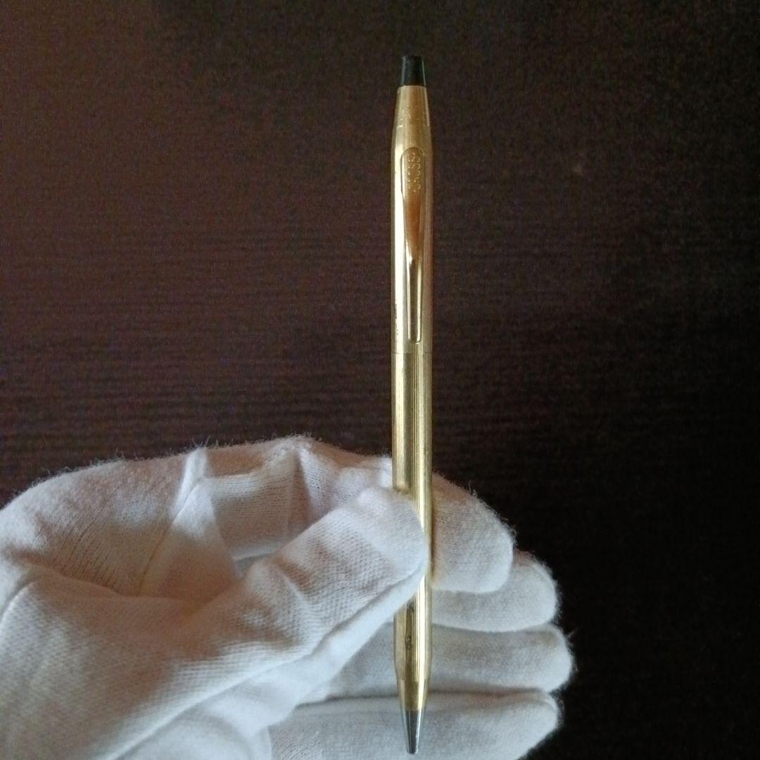 Cross brand gold color twist-operated ballpoint pen with slim sleek design