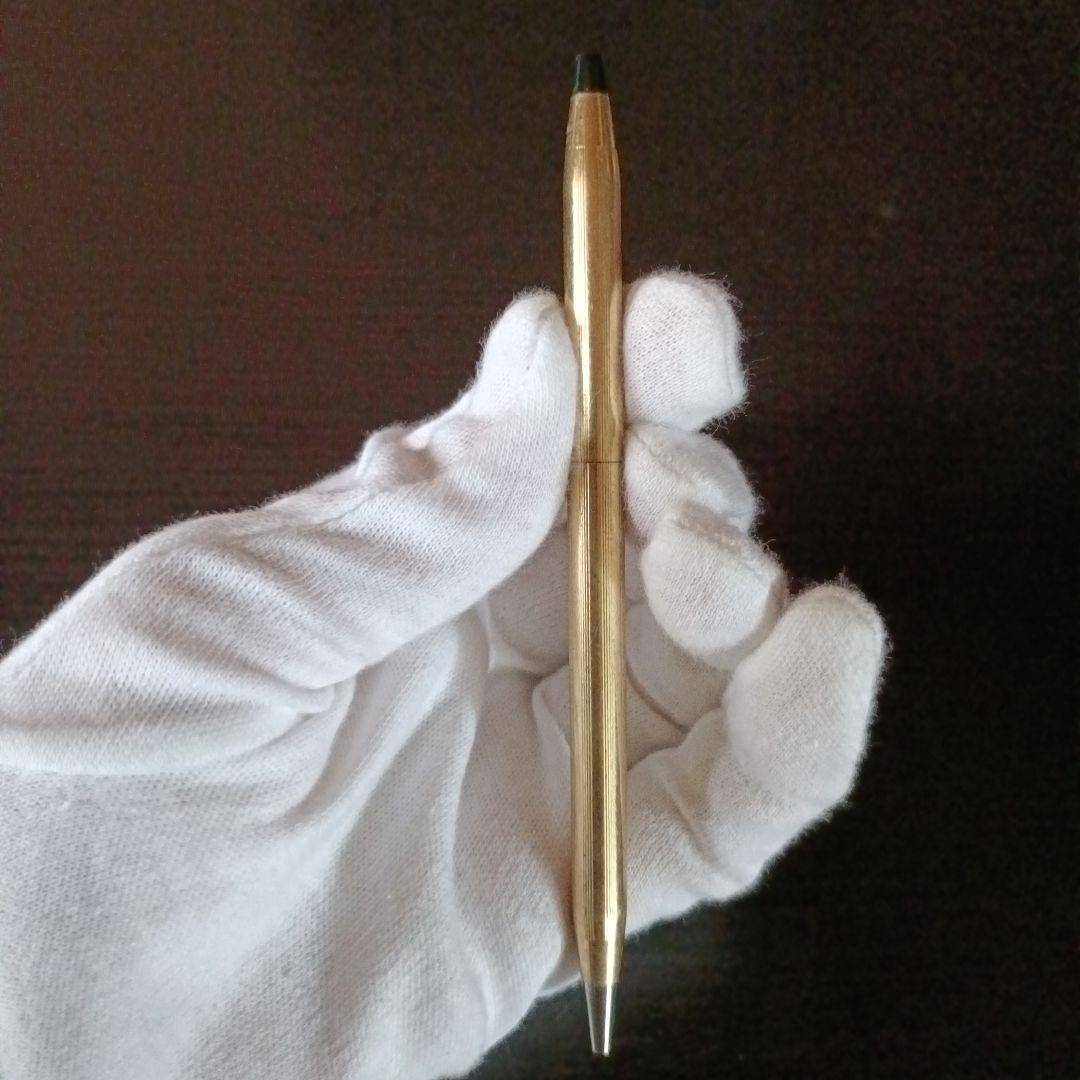 Cross brand gold color twist-operated ballpoint pen with slim sleek design