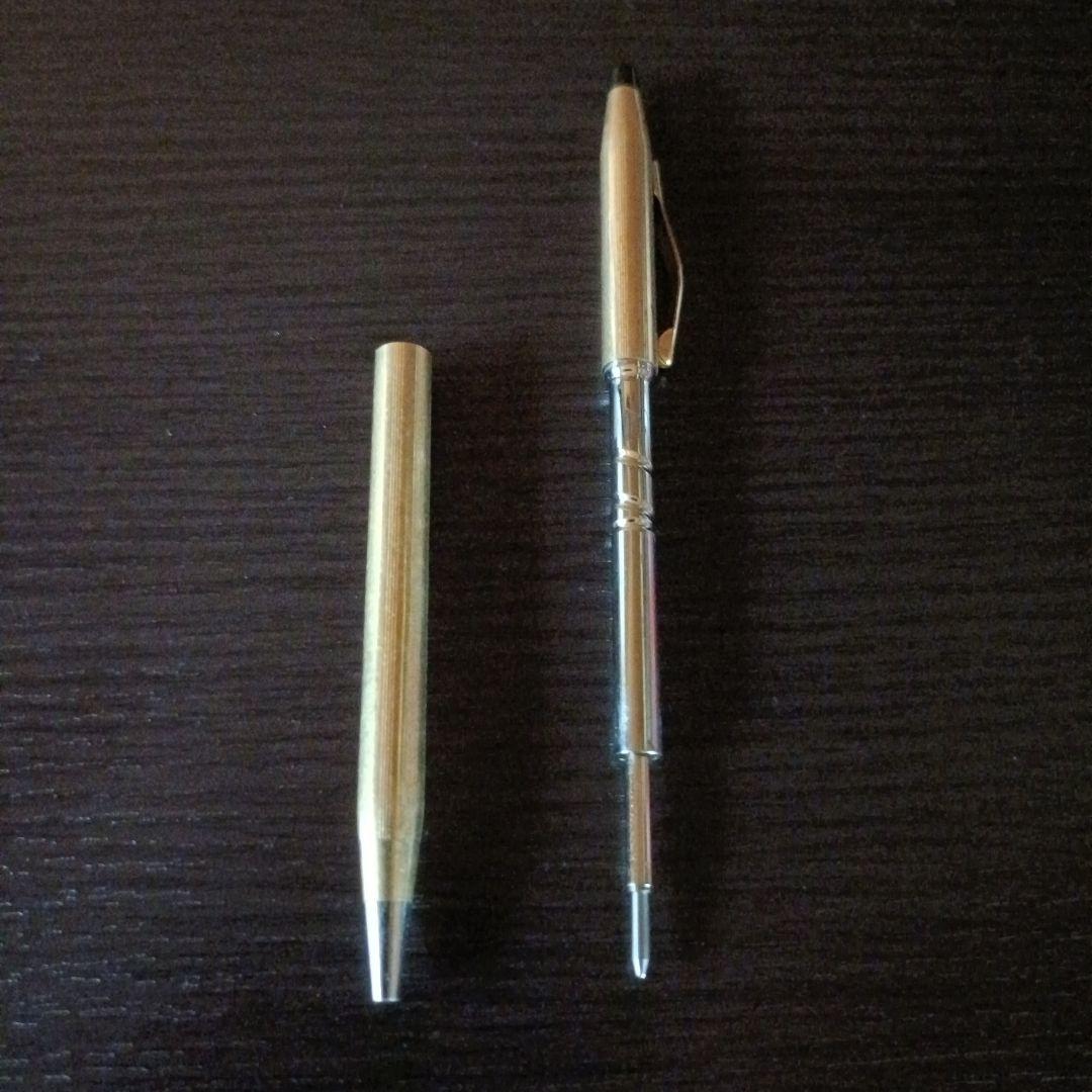 Cross brand gold color twist-operated ballpoint pen with slim sleek design