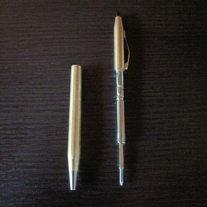 Cross brand gold color twist-operated ballpoint pen with slim sleek design