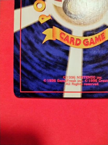 Kizuna Original first edition Red Shine Charizard holographic card with spiral holo on top left, showing fine scratches
