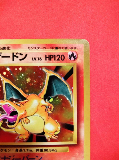 Kizuna Original first edition Red Shine Charizard holographic card with spiral holo on top left, showing fine scratches