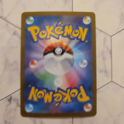 Yu Nagaba Nymphia Pokémon promotional card with minor scratches and protective sleeve