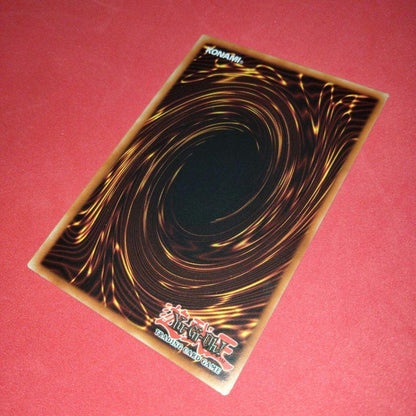 Yu-Gi-Oh Gear Blue-Eyes White Dragon secret rare error card LOB-125 with gold letters and wavy paper