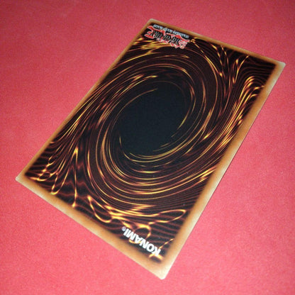 Yu-Gi-Oh Gear Blue-Eyes White Dragon secret rare error card LOB-125 with gold letters and wavy paper