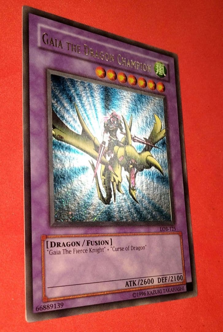 Yu-Gi-Oh Gear Blue-Eyes White Dragon secret rare error card LOB-125 with gold letters and wavy paper
