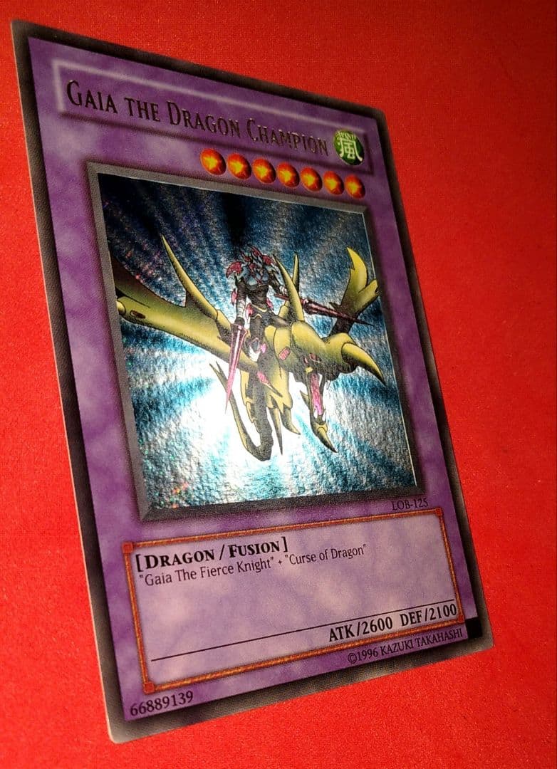 Yu-Gi-Oh Gear Blue-Eyes White Dragon secret rare error card LOB-125 with gold letters and wavy paper