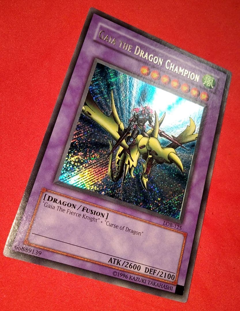 Yu-Gi-Oh Gear Blue-Eyes White Dragon secret rare error card LOB-125 with gold letters and wavy paper