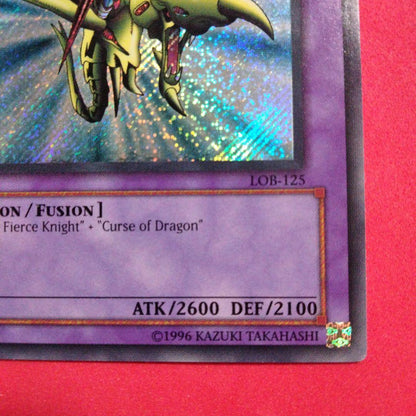 Yu-Gi-Oh Gear Blue-Eyes White Dragon secret rare error card LOB-125 with gold letters and wavy paper