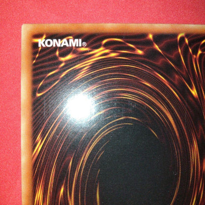 Yu-Gi-Oh Gear Blue-Eyes White Dragon secret rare error card LOB-125 with gold letters and wavy paper
