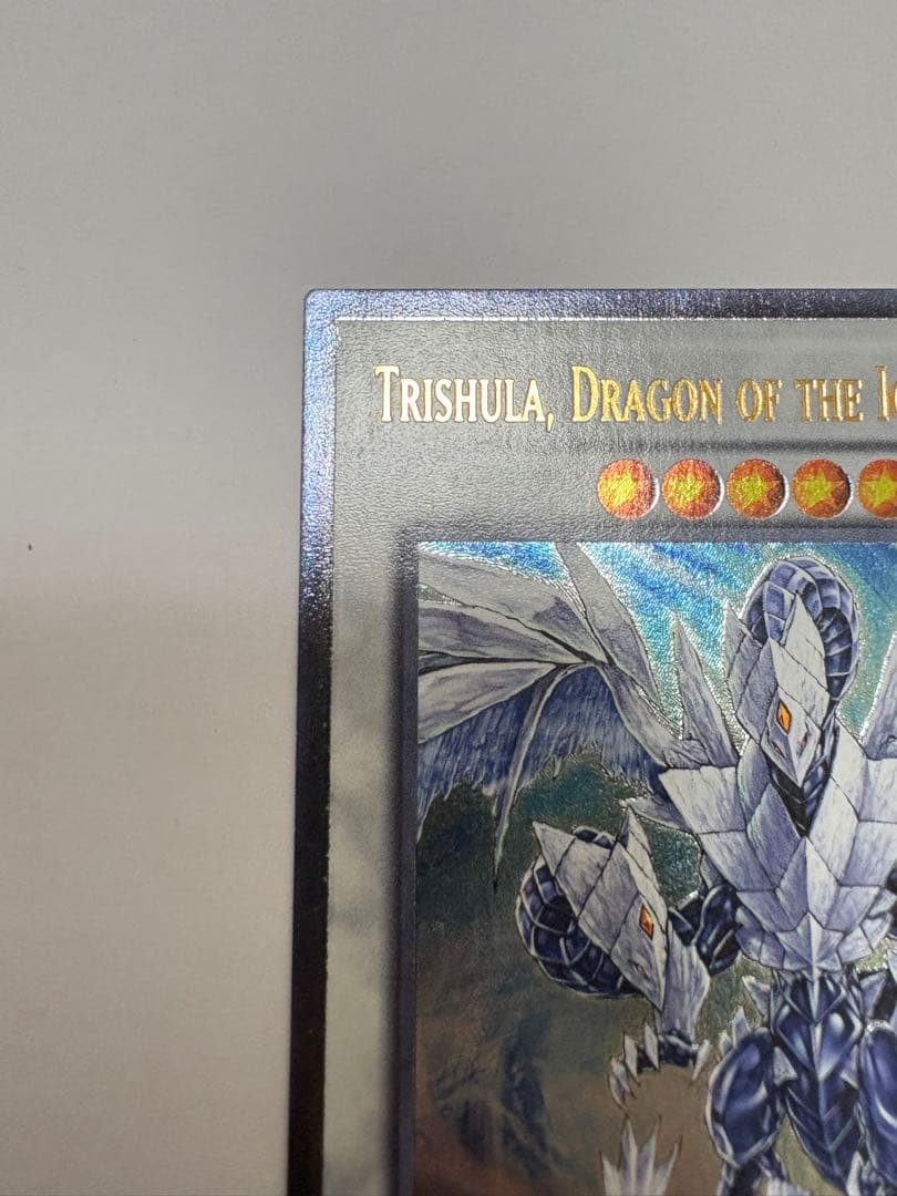 Yugioh Ice Conclave of the Dragon Trishula English Relief card from North America with visible dent on bottom back