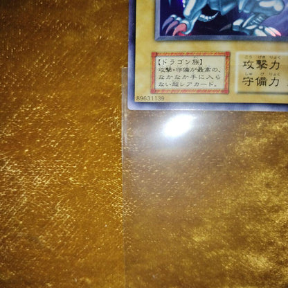 Yugioh Blue-Eyes White Dragon Ultra Rare trading card Japan import with minor surface wear in hard case