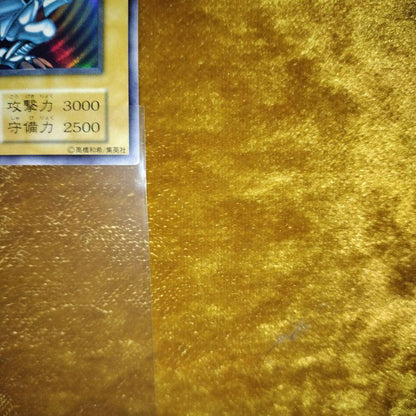 Yugioh Blue-Eyes White Dragon Ultra Rare trading card Japan import with minor surface wear in hard case
