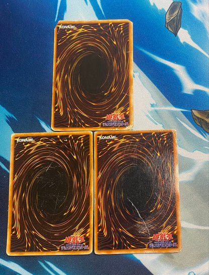 Yugioh Blue-Eyes White Dragon, Red-Eyes Black Dragon, Black Magician cards in used condition stored in desiccant box