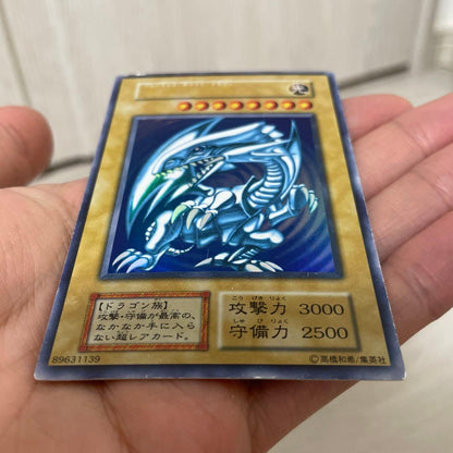 Yugioh Blue-Eyes White Dragon Initial Ultra Rare Japanese card with visible scratches