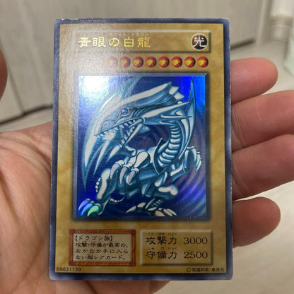 Yugioh Blue-Eyes White Dragon Initial Ultra Rare Japanese card with visible scratches