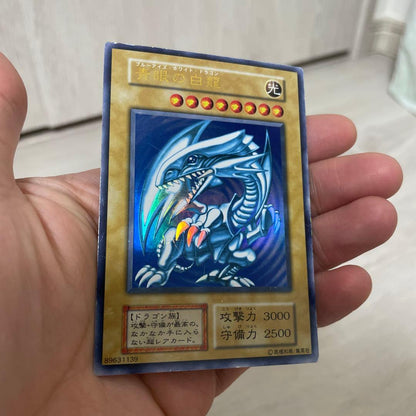 Yugioh Blue-Eyes White Dragon Initial Ultra Rare Japanese card with visible scratches