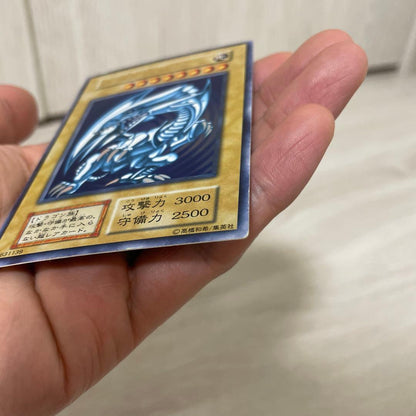 Yugioh Blue-Eyes White Dragon Initial Ultra Rare Japanese card with visible scratches