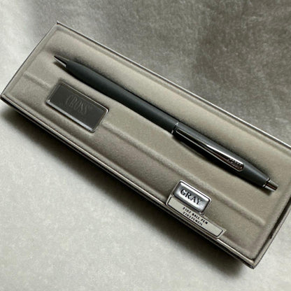 Cross gray metal ballpoint pen with silver clip displayed in its case, made in USA