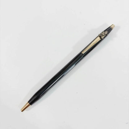 Cross Mickey ballpoint pen with black and gold design featuring Mickey Mouse figure, slight tarnish visible