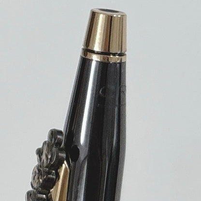 Cross Mickey ballpoint pen with black and gold design featuring Mickey Mouse figure, slight tarnish visible