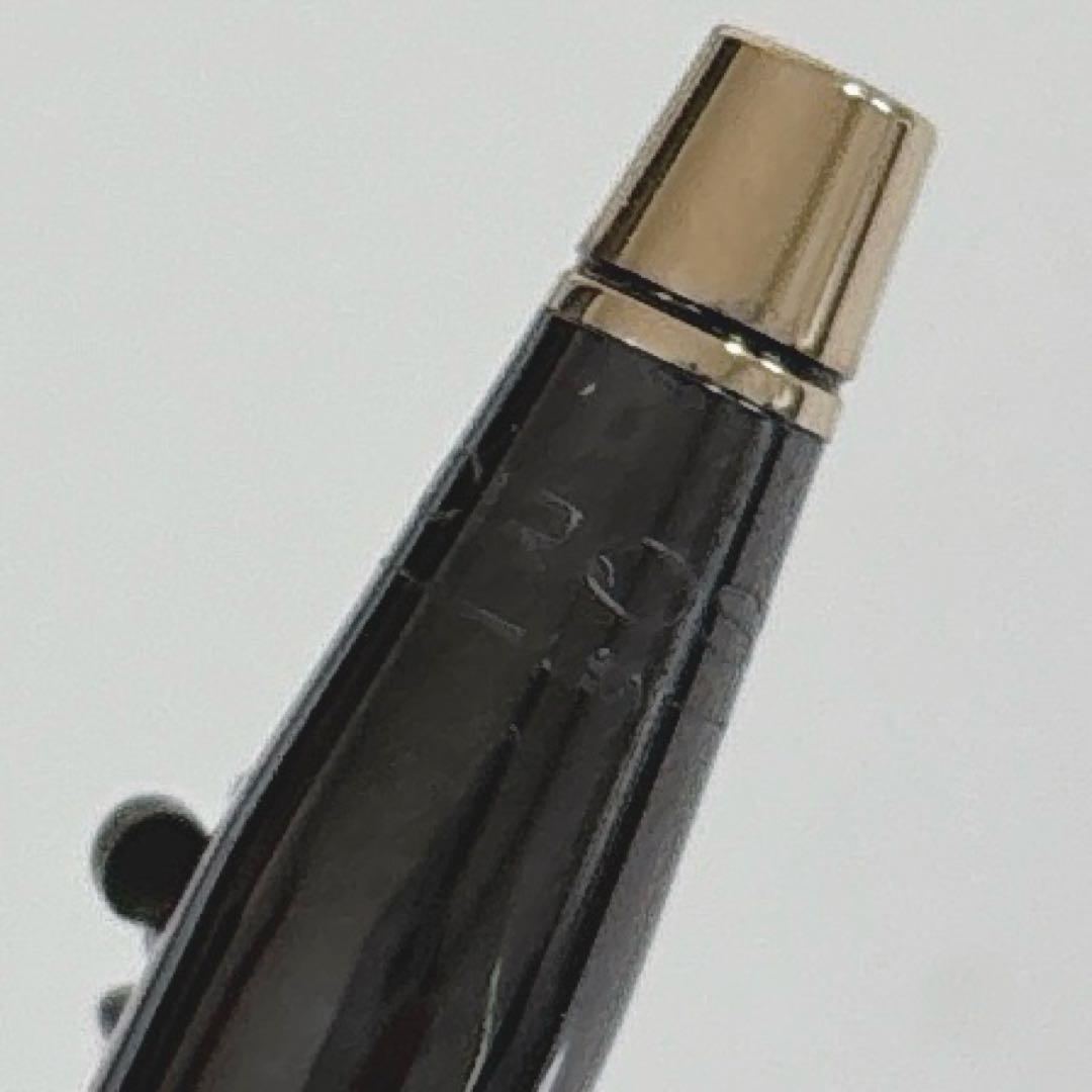 Cross Mickey ballpoint pen with black and gold design featuring Mickey Mouse figure, slight tarnish visible