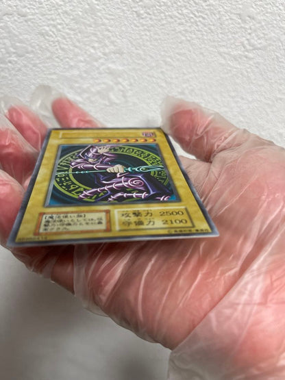 Yugioh Black Magician Early Edition Ultra Rare Japanese trading card with minor wear and scratches