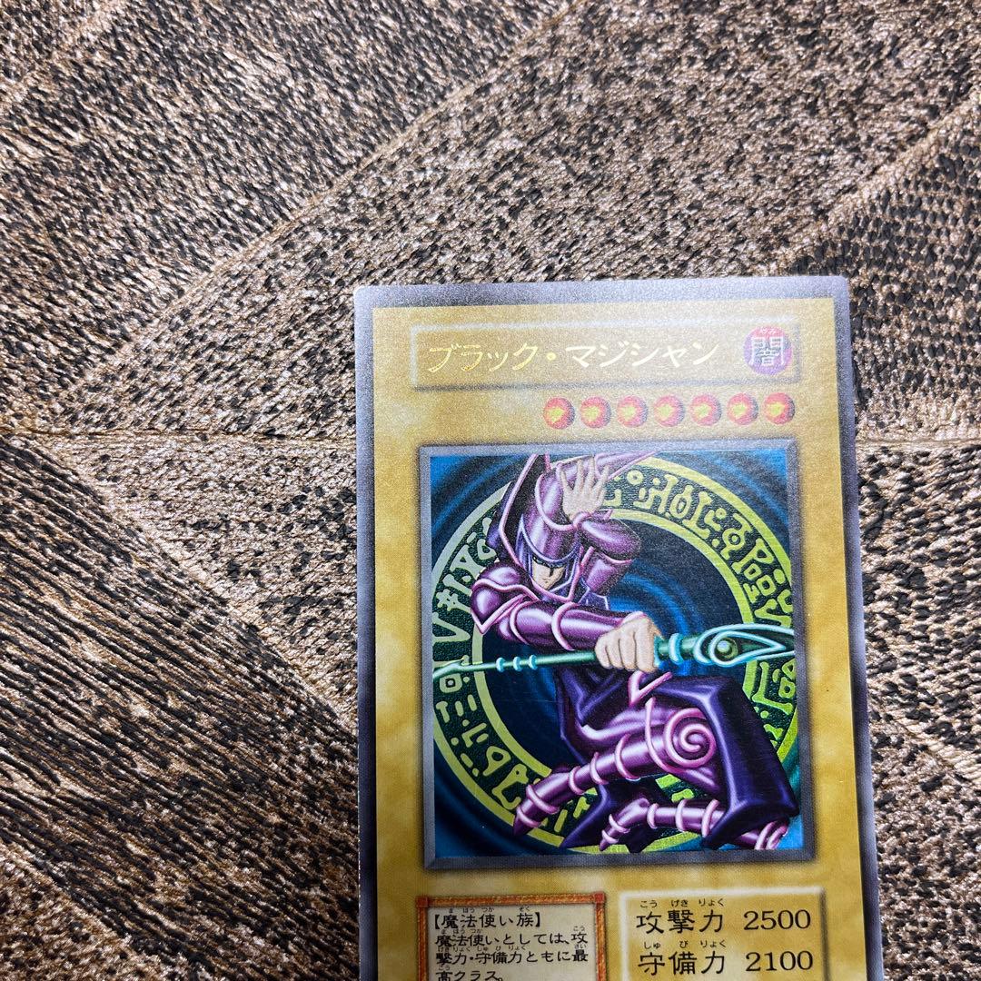 Yugioh Black Magician Early Edition Ultra Rare Japanese trading card with minor wear and scratches