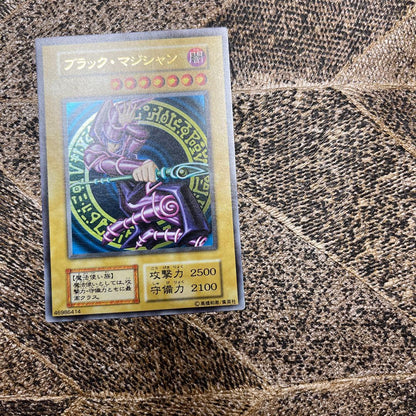 Yugioh Black Magician Early Edition Ultra Rare Japanese trading card with minor wear and scratches