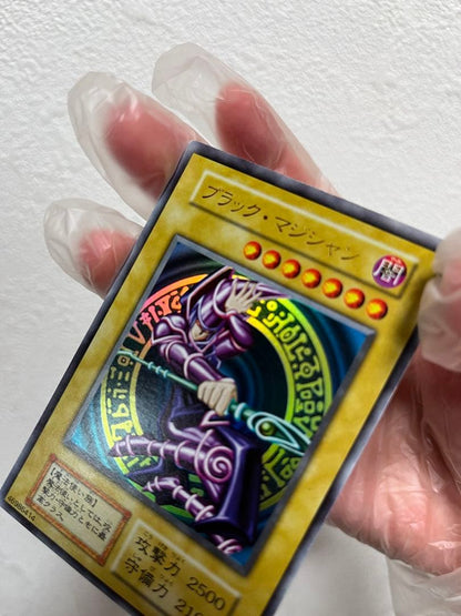Yugioh Black Magician Early Edition Ultra Rare Japanese trading card with minor wear and scratches