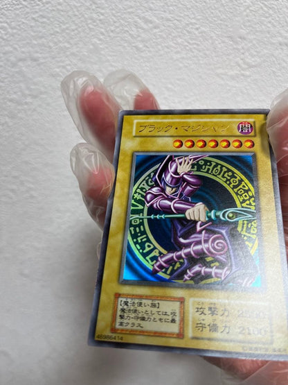 Yugioh Black Magician Early Edition Ultra Rare Japanese trading card with minor wear and scratches