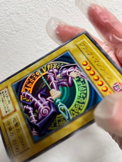 Yugioh Black Magician Early Edition Ultra Rare Japanese trading card with minor wear and scratches