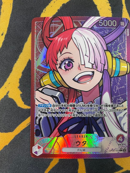 Uta One Piece Card Game Leader Parallel OP06-001 card with film elements showing slight corner defect