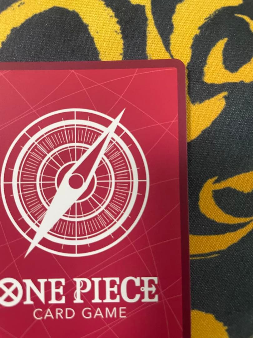 Uta One Piece Card Game Leader Parallel OP06-001 card with film elements showing slight corner defect