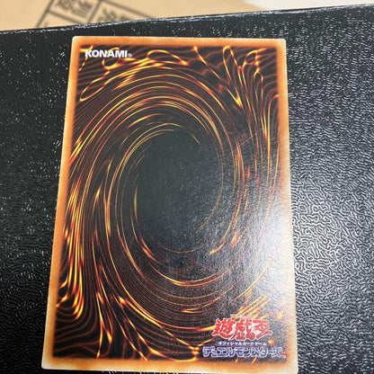 Bandai Toon Black Magician Girl Ultra Rare trading card showing visible wear, dents, creases, and chips