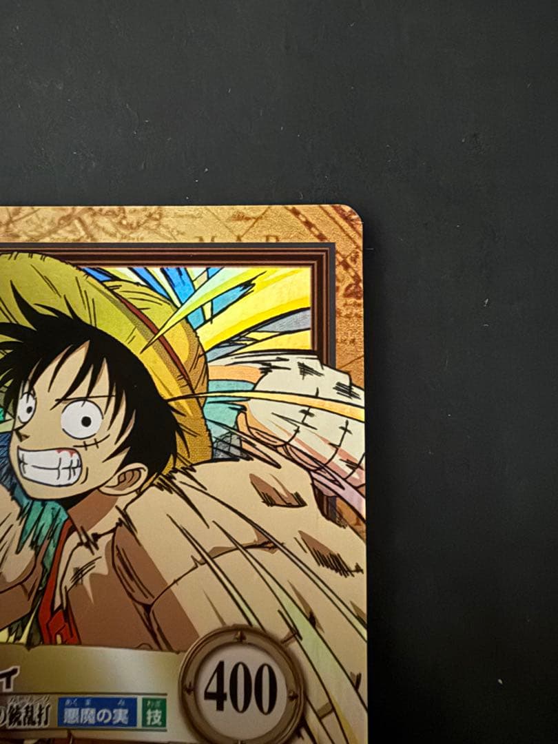 One Piece Hyper Battle Carddass Luffy Gum-Gum Gatling Gun collectible game card in protective loader