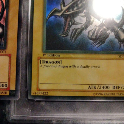 Yu-Gi-Oh! Red-Eyes Black Dragon SDJ-001 Ultra Rare English trading card with yellowed surface
