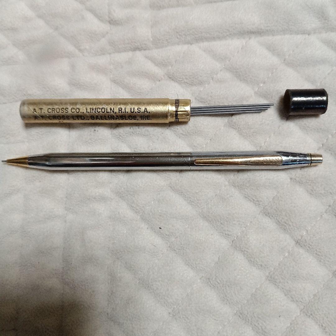 A.T. Cross silver and gold ballpoint pen made in USA shown with replacement refill