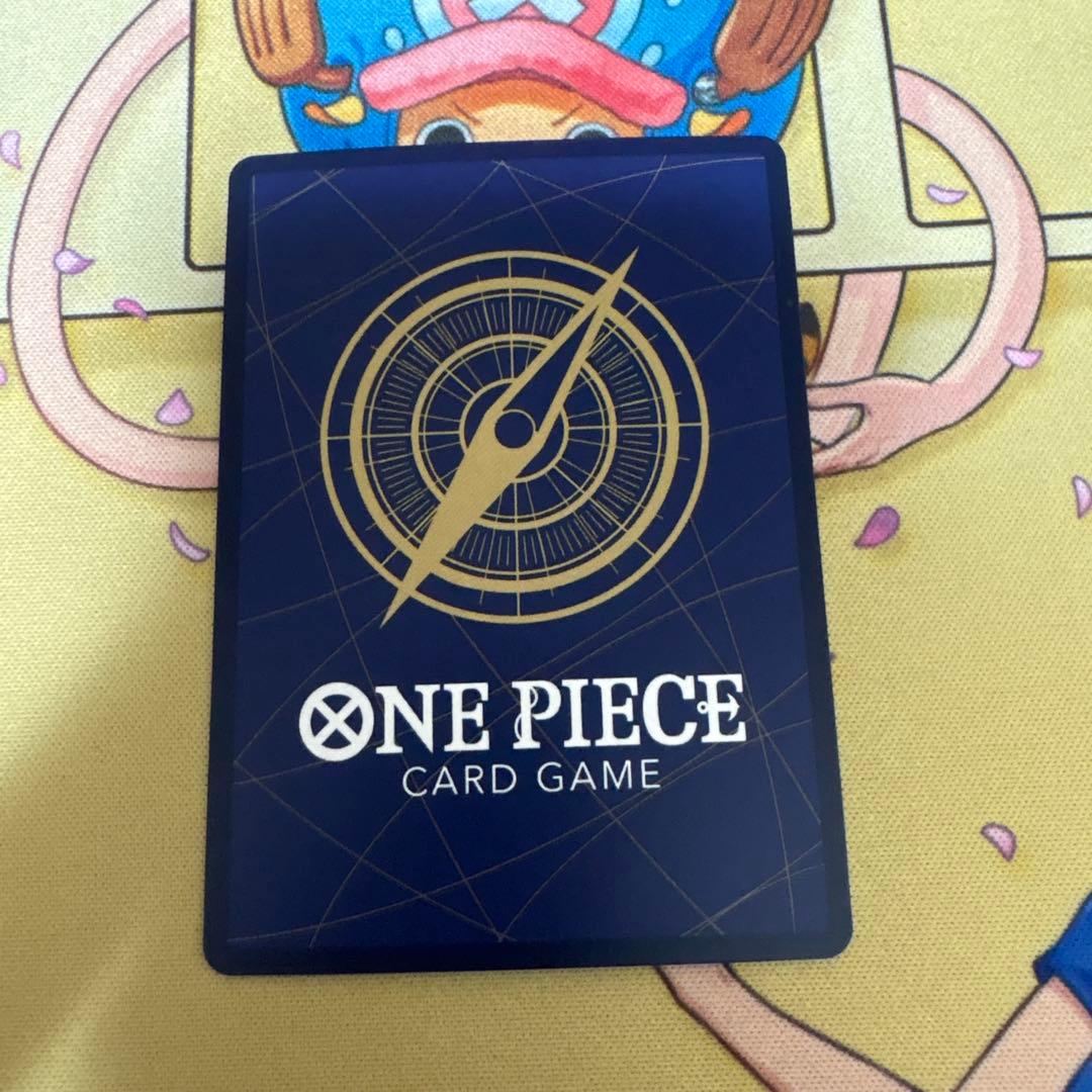Nami Premium Card Collection Parallel OP02-036 one piece card with dent at upper left corner on back