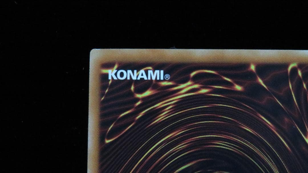 Yu-Gi-Oh Bandai Sacrifices holographic rare card DP19-JP000 with visible scratches and wear