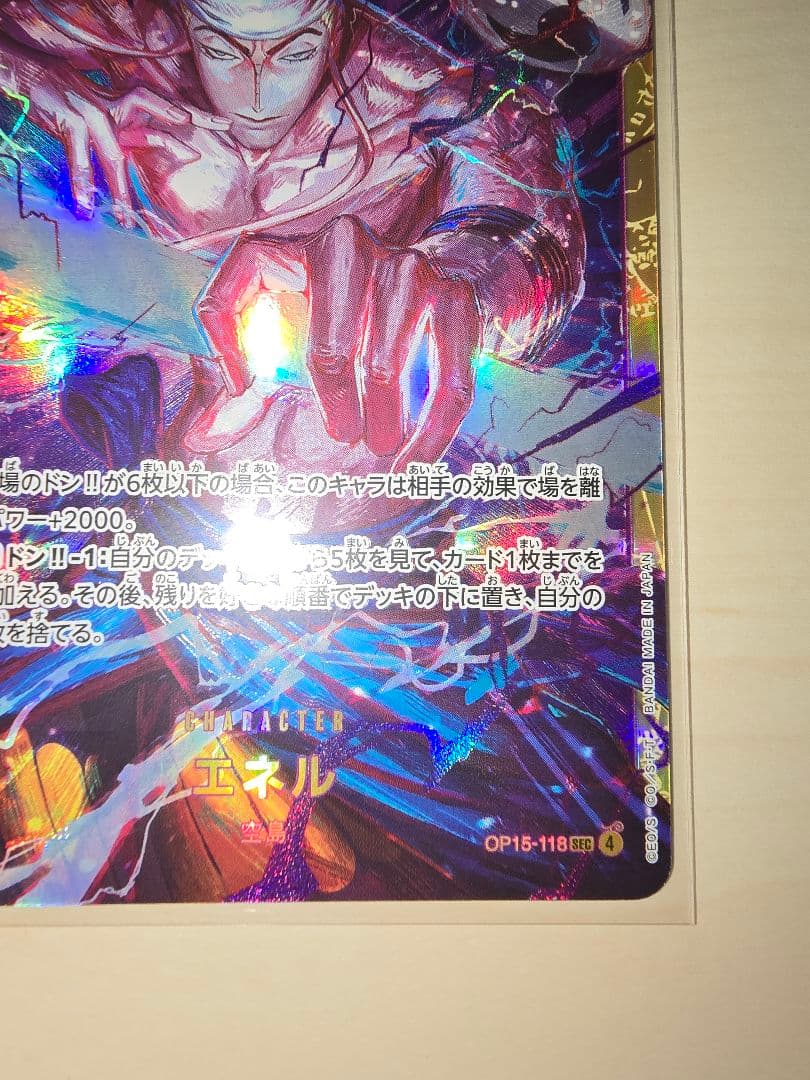 One Piece Energy Card Secret Rare in protective hard sleeve with minor signs of use