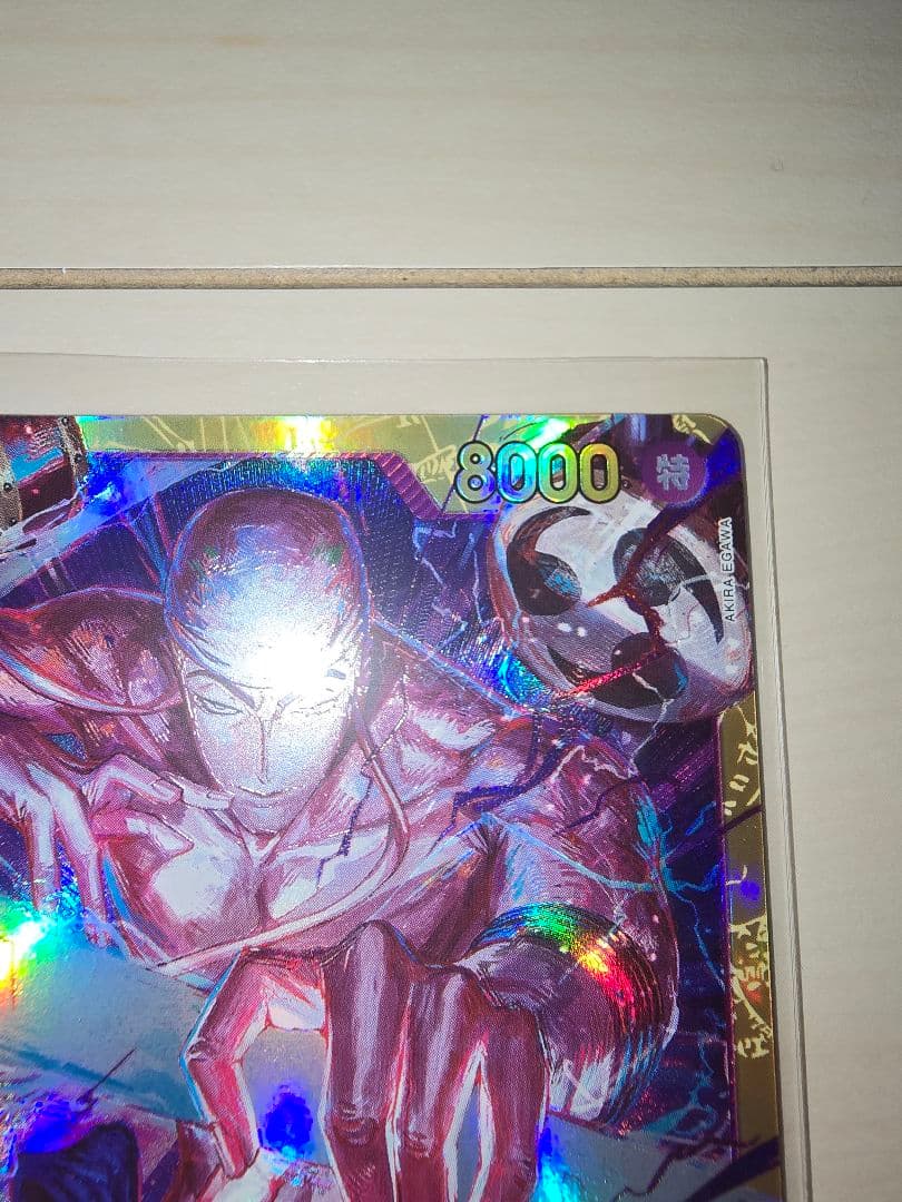 One Piece Energy Card Secret Rare in protective hard sleeve with minor signs of use