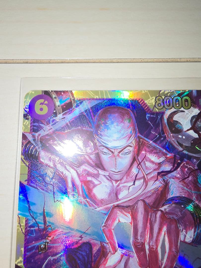 One Piece Energy Card Secret Rare in protective hard sleeve with minor signs of use
