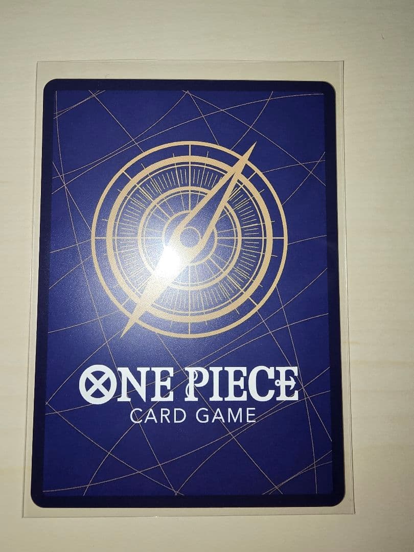 One Piece Energy Card Secret Rare in protective hard sleeve with minor signs of use