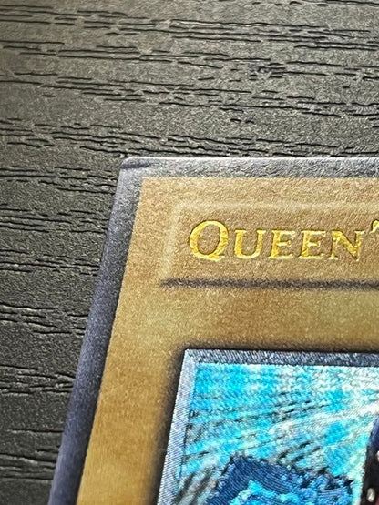 Yugioh Old Asia Edition Queen's Knight 1st Relief card showing minor scratches and wear