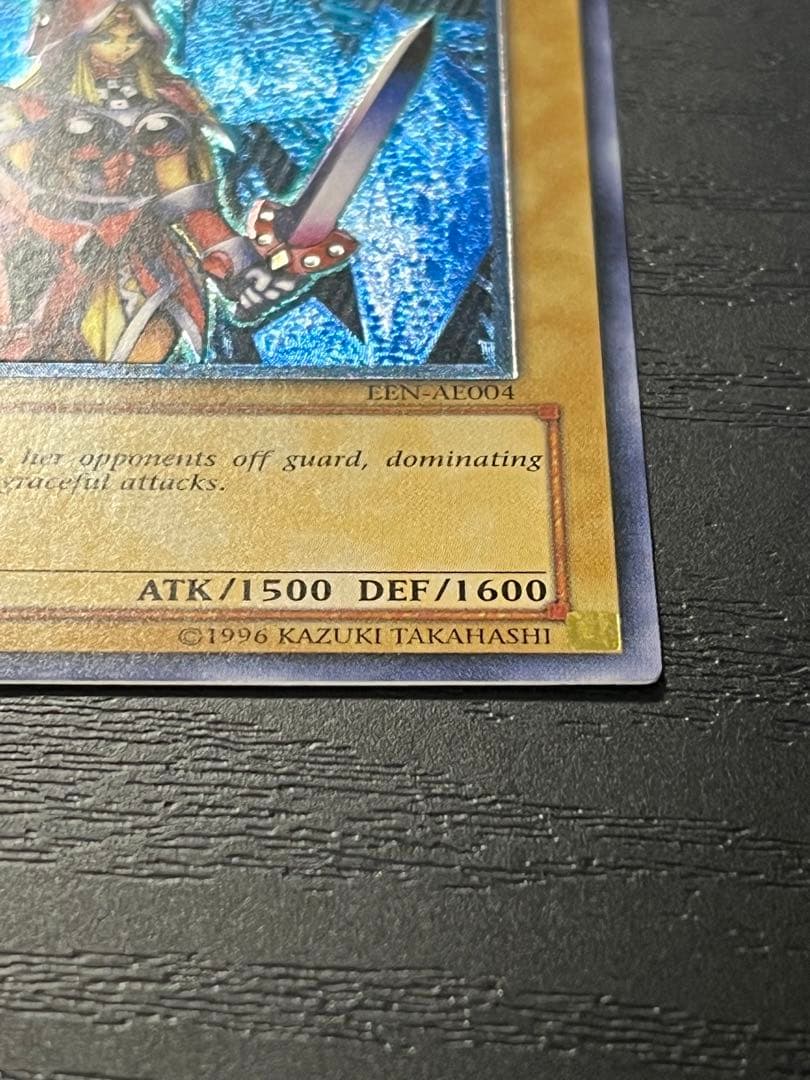 Yugioh Old Asia Edition Queen's Knight 1st Relief card showing minor scratches and wear