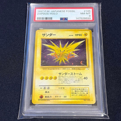 Vintage Japanese Pokemon Card Thunder with PSA8 grade featuring holo bleed collectible card