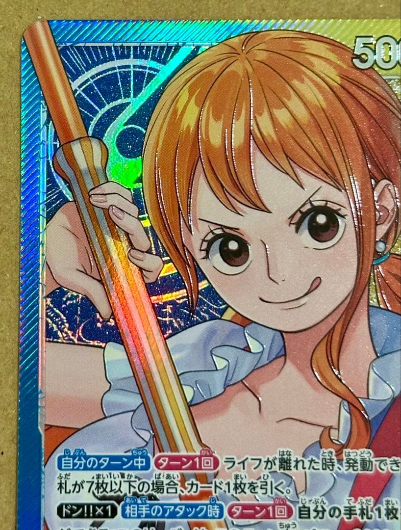 One Piece trading card featuring Nami L Leader Parallel OP11-041 from Japan import, stored in protective sleeve